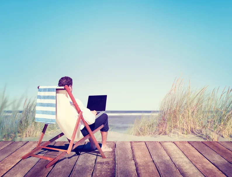 Businessman Working by the Beach