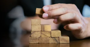 CMA exam candidate stacking the building blocks to study success