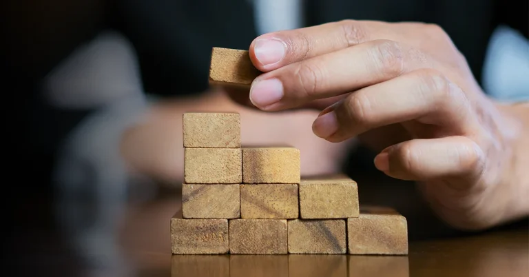 CMA exam candidate stacking the building blocks to study success