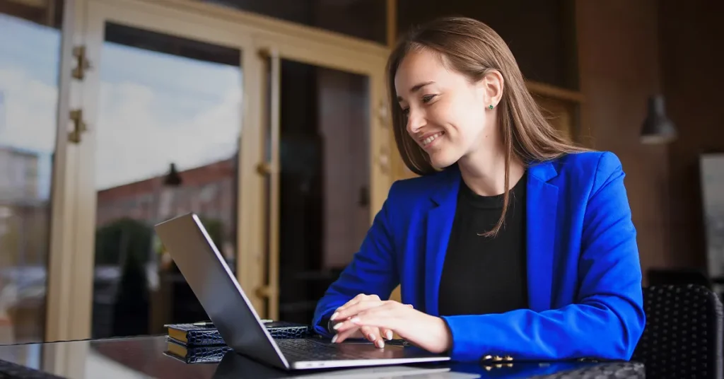 CMA candidate studying via laptop and notebook