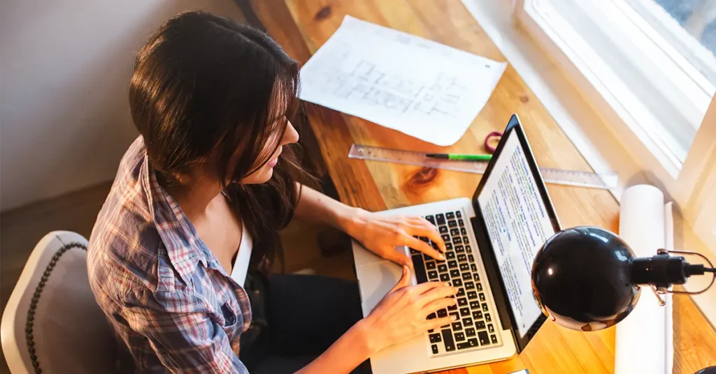 CPA candidate using best CPA flashcards on a laptop for exam prep.