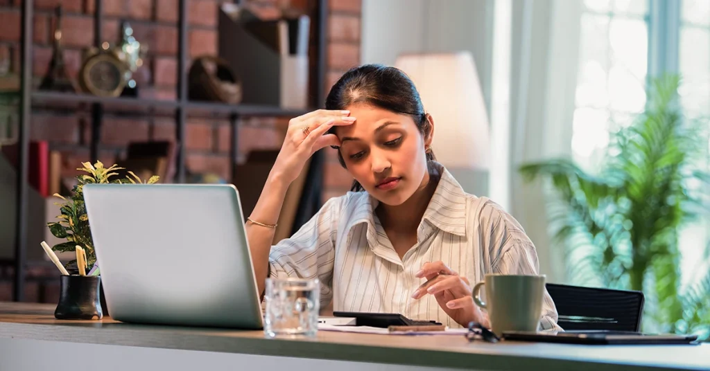 Indian professional studying for the US CPA exam while managing work stress.