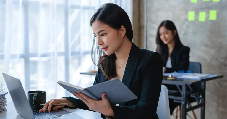 Professionals studying with laptops using the best adaptive learning CPA review course