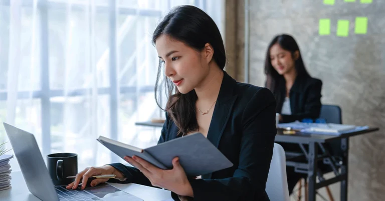 Professionals studying with laptops using the best adaptive learning CPA review course